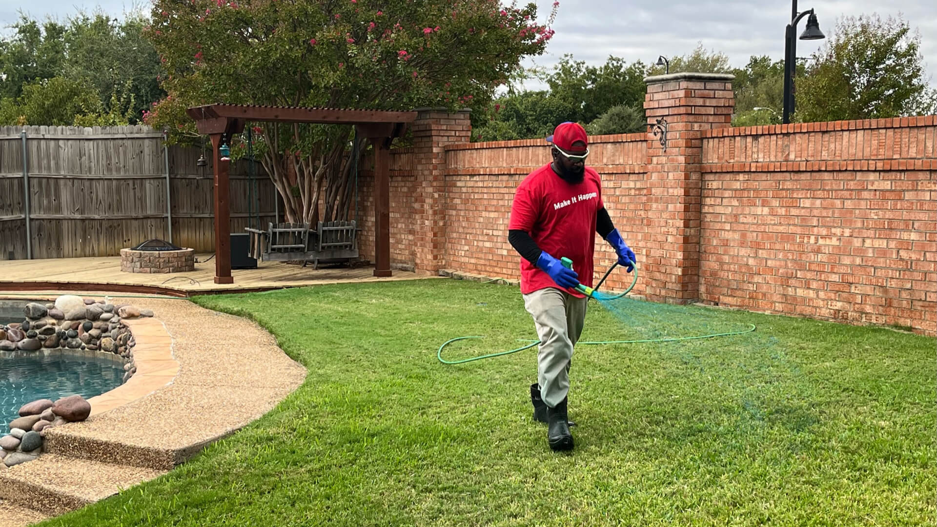 Buffalo Outdoor worker spraying a lawn in Keller, TX.