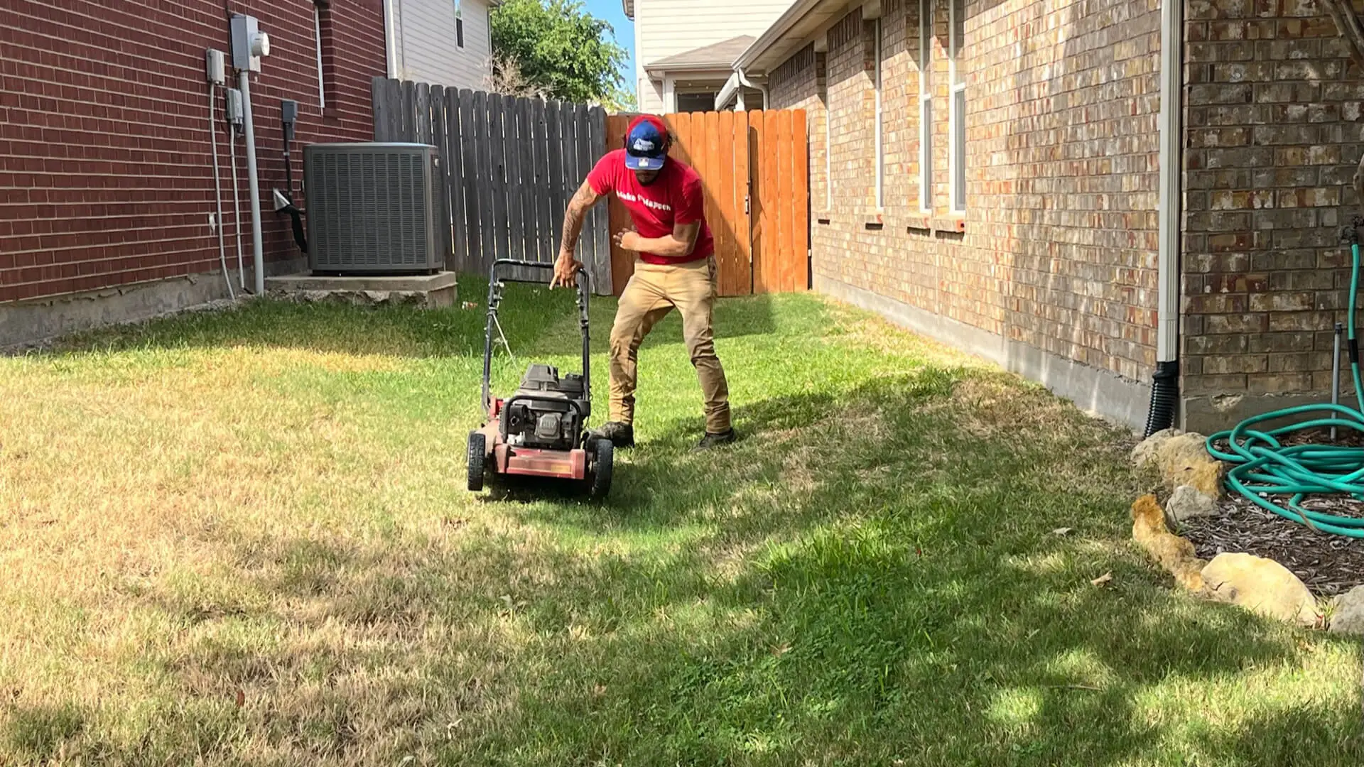 Buffalo Outdoor worker mowing a lawn in Keller, Texas.