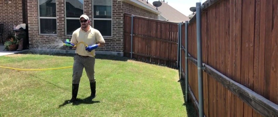 First Cut employee fertilizing lawn in Westworth Village, TX.